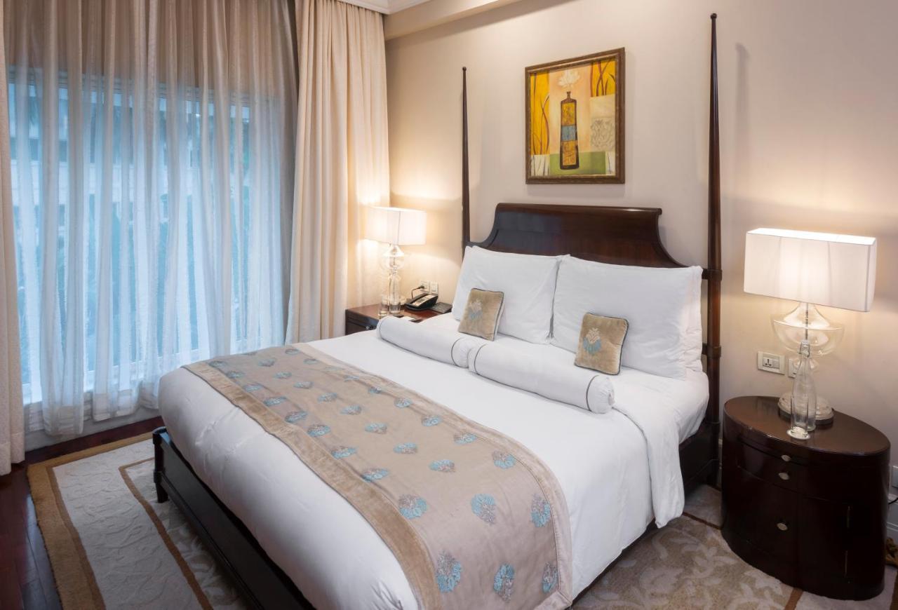 The Claridges New Delhi Hotel Ngoại thất bức ảnh A bedroom at the Taj Bengal